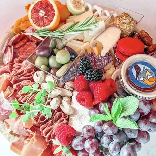 a platter of fruit and cheese
