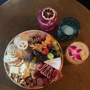 Mini charcuterie board from Fable and cocktails from Harvey's Bar