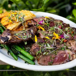 steak dish with potatoes and broccolini