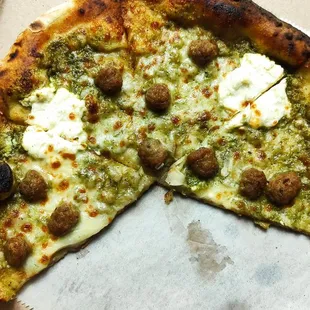 a half eaten pizza in a box