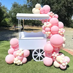Our candy cart with a plush 10ft Garland