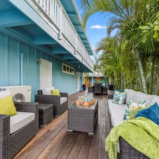 The Conversation 7 Piece and Side Table in our Brown wicker and Light gray cushions in Kailua, HI.