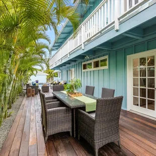 The Rectangular Dining Set in our Brown wicker and Light gray cushions in Kailua, HI.
