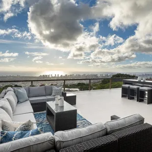 The 11 piece u-shape sectional. Brown wicker, light gray cushions. Bar set. Located in Wilhemina Rise.