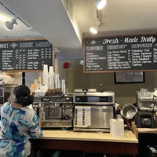 a woman standing at a counter