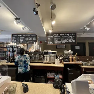 a woman standing at the counter