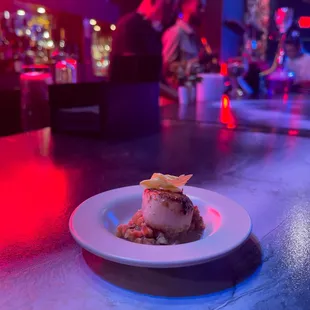 This dish beautifully combines the tender, sweet scallops with the aromatic ginger rice, enhanced by warm spices of Ethiopian cuisine.