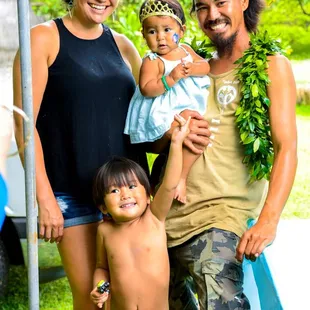 Happy family at Baby&apos;s first birthday. Face Painting In Paradise Hawaii.