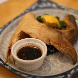 a plate of food with a dipping sauce
