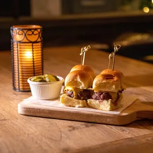 Mini Burgers -3 potato roll, Pat LaFrieda short rib patty, cheese, ketchup, pickles