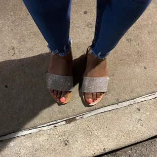 a woman&apos;s feet in sandals