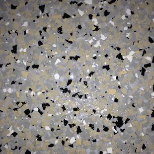 Factory 1 garage floor, close up of fully flaked epoxy flooring.