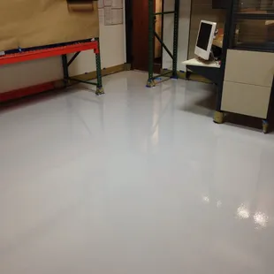 Factory 1 epoxy warehouse floor.  Cost effective, single color, easy to clean and looks great.