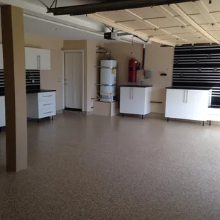Factory 1 full garage makeover, epoxy flooring, drywall repair, paint, can lighting, cabinets, slat walls,  garage door openers.