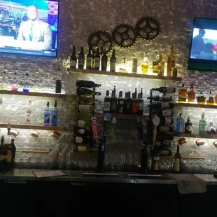 a bar with a variety of liquors
