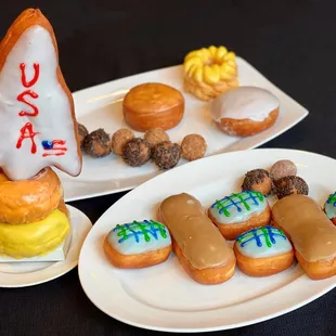 a variety of doughnuts on plates