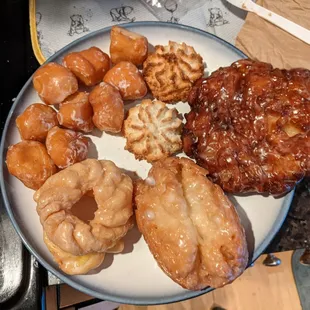 a plate of doughnuts and pastries