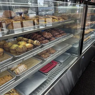 a display case filled with baked goods