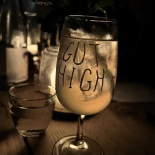 a glass of alcohol and a candle