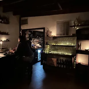 a woman sitting at a bar