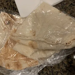 Packaged thin pita that comes with your meal/salad.