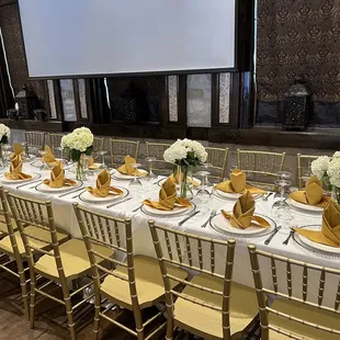 a long table set for a formal dinner