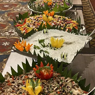 a variety of food on a buffet table