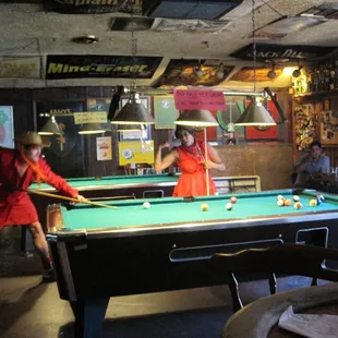 pool players from the red dress run