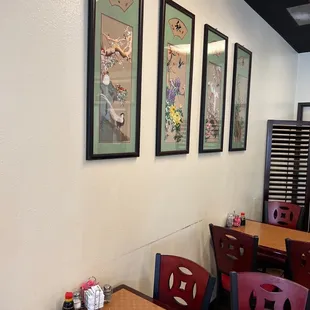 a dining area with tables and chairs