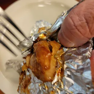 The paper wrapped chicken morsel for my guy.