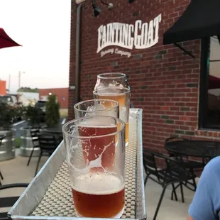 a glass of beer on a tray