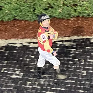 A jockey after his race....the track was super muddy after the heavy rains today.