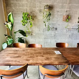 a wooden table and chairs