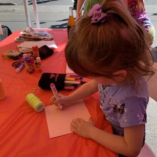 Coloring at the State Farm booth.