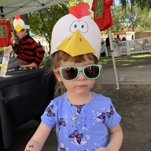 She loved her chicken hat.