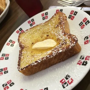 a plate of french toast with butter
