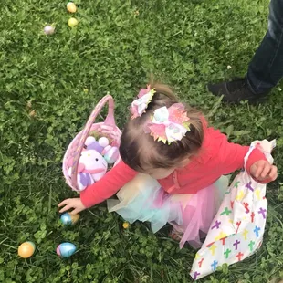 Easter Eggstravaganza, my daughter finding eggs at the Easter Egg Hunt, bag was goodies from a Baptist Church booth!
