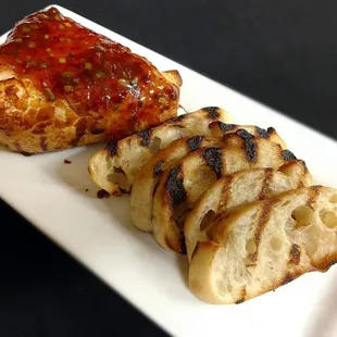 grilled meat and bread on a white plate