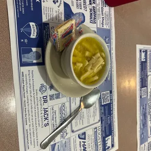 a bowl of soup and a spoon
