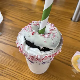 a cup of ice cream with sprinkles