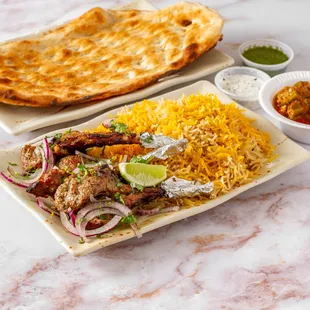 Lamb Chops
Pieces of tender lamb chops marinated and broiled on a skewer over grill. Comes with 3 free sides