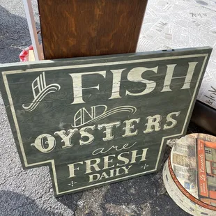 a fish and oyster sign