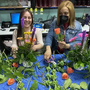 Leslie showing me how properly place the flowers.