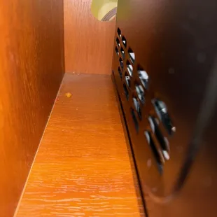 Old food crumbs next to the microwave