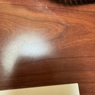 The bedside table has clearly not been wiped down