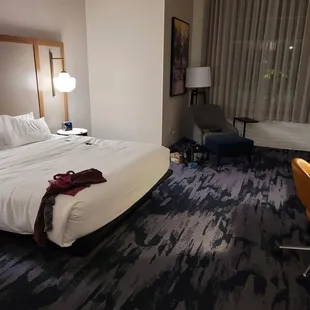 Big windows and bed. The alarm clock has adapters so you can charge your devices.