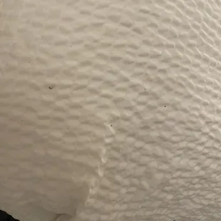 Stains on the bed next to the window.