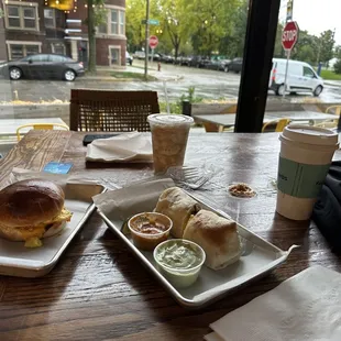 Blended cold coffee, hot latte, egg and bacon sandwich and breakfast burrito