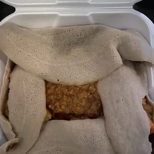 a meal in a styrofoam container