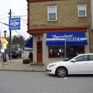 a car parked in front of a restaurant